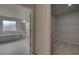 Bathroom view featuring a freestanding tub, window, and a glimpse of a large walk-in closet at 205 Haverling Pass, Hampton, GA 30228