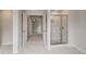 Bright bathroom with glass-enclosed shower and elegant tile work at 205 Haverling Pass, Hampton, GA 30228