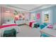 Bright bedroom featuring two twin beds, colorful decor, and a well-lit study area at 205 Haverling Pass, Hampton, GA 30228