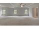 Expansive bedroom with tray ceiling, carpet flooring and abundant natural light at 205 Haverling Pass, Hampton, GA 30228