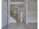 Welcoming foyer with hardwood floors, elegant staircase, and an abundance of natural light at 205 Haverling Pass, Hampton, GA 30228