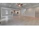 Open-concept living room with fireplace leads into the kitchen and the staircase to the second floor at 205 Haverling Pass, Hampton, GA 30228