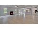Open-concept living room with fireplace leads into the kitchen and access to the backyard at 205 Haverling Pass, Hampton, GA 30228