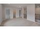 Open loft area offering versatile space and access to multiple rooms at 205 Haverling Pass, Hampton, GA 30228
