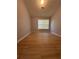 Bright bedroom with hardwood floors and a large window at 91 Brookway Trce, Norcross, GA 30071