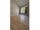 Bright bedroom featuring sleek floors, neutral walls and a large window with natural light at 91 Brookway Trce, Norcross, GA 30071