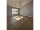 Bright bedroom featuring sleek floors, neutral walls and a large window with natural light at 91 Brookway Trce, Norcross, GA 30071