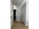 Hallway featuring sleek floors, neutral walls and doors to other rooms at 91 Brookway Trce, Norcross, GA 30071