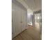 Hallway with hardwood floors and white doors at 91 Brookway Trce, Norcross, GA 30071