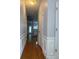 Entry hallway featuring chair rail molding and luxury vinyl flooring at 91 Brookway Trce, Norcross, GA 30071