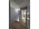 Hallway with hardwood floors leading to the rooms at 91 Brookway Trce, Norcross, GA 30071