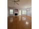 Bright living room with wood floors, a fireplace, and natural light at 91 Brookway Trce, Norcross, GA 30071