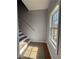Stairwell showcasing natural light with temporary flooring protection at 91 Brookway Trce, Norcross, GA 30071