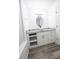 Bright bathroom featuring granite counters, vessel sink, oval mirror, and wood look flooring at 1488 Cottage Way #32, Marietta, GA 30066
