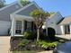 Charming home with a well-manicured front yard, covered porch, and inviting curb appeal at 1488 Cottage Way #32, Marietta, GA 30066