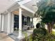 Inviting covered porch with seating area, stylish columns, and attractive landscaping at 1488 Cottage Way #32, Marietta, GA 30066