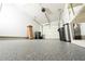 Spacious garage with epoxy flooring and ample storage space for vehicles and belongings at 1488 Cottage Way #32, Marietta, GA 30066