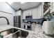 Modern kitchen with stainless steel appliances, granite countertops, and white cabinetry at 1488 Cottage Way #32, Marietta, GA 30066