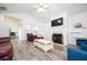 Bright living room with vaulted ceiling, fireplace, modern flooring, and open concept design at 1488 Cottage Way #32, Marietta, GA 30066