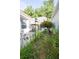 Backyard featuring a patio, bird feeder, unique yard decor, and maintained plants at 1488 Cottage Way #32, Marietta, GA 30066