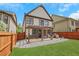 A spacious backyard with a stone patio, pergola, wood fence, and grill, perfect for entertaining guests at 5143 Micaela Way, Duluth, GA 30096