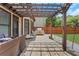 Backyard patio with built in grill, dining space and beautiful landscaping at 5143 Micaela Way, Duluth, GA 30096