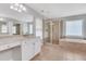 Bright bathroom with tile floor, shower, tub, double vanity with granite counters at 5143 Micaela Way, Duluth, GA 30096