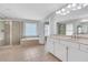 Bright bathroom with tile floor, shower, tub, double vanity with granite counters at 5143 Micaela Way, Duluth, GA 30096