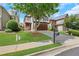 Attractive home featuring a lush green lawn, professional landscaping, and a stately shade tree in the front yard at 5143 Micaela Way, Duluth, GA 30096