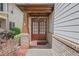 Welcoming entryway with double doors, brick accents, and covered porch at 5143 Micaela Way, Duluth, GA 30096