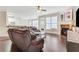 Spacious living room featuring hardwood floors, fireplace, and neutral paint at 5143 Micaela Way, Duluth, GA 30096