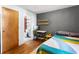 Modern bedroom with a small office area, gray accent wall, and stylish decor at 562 Formwalt Sw St # 5, Atlanta, GA 30312