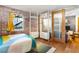 Stylish bedroom with exposed brick, modern closet system, and a bright window at 562 Formwalt Sw St # 5, Atlanta, GA 30312