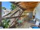Charming outdoor deck with wooden flooring, rustic bench, and staircase access at 562 Formwalt Sw St # 5, Atlanta, GA 30312
