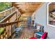 Inviting outdoor deck with wooden flooring, rustic bench, and staircase access at 562 Formwalt Sw St # 5, Atlanta, GA 30312