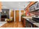 Cozy eat-in kitchen features stainless steel appliances, brick accent wall, and modern lighting at 562 Formwalt Sw St # 5, Atlanta, GA 30312