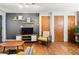 Inviting living area with modern entertainment setup, shelves, and hardwood floors at 562 Formwalt Sw St # 5, Atlanta, GA 30312
