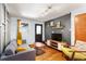 Cozy living room with a grey sofa, mid-century modern accents, and warm natural light at 562 Formwalt Sw St # 5, Atlanta, GA 30312