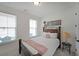 Cozy bedroom with carpet, natural light, and neutral decor for a comfortable and inviting space at 518 Newstead Way, Woodstock, GA 30188