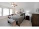 Relaxing main bedroom with soft carpet, modern decor, plenty of natural light, and a serene atmosphere at 518 Newstead Way, Woodstock, GA 30188