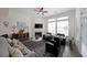 Inviting living room with a fireplace and a ceiling fan at 518 Newstead Way, Woodstock, GA 30188