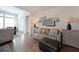 Comfortable living room with hardwood floors, stylish decor, ample seating, and plenty of natural light at 518 Newstead Way, Woodstock, GA 30188