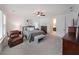 A main bedroom has a ceiling fan, ensuite bath, and ample natural light at 518 Newstead Way, Woodstock, GA 30188