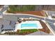 Overhead view of the pool and clubhouse area featuring manicured grounds in a beautiful community at 518 Newstead Way, Woodstock, GA 30188