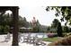 Community pool with chairs and sunbathing space at new home development at 518 Newstead Way, Woodstock, GA 30188