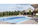Community pool with chairs and sunbathing space at new home development at 518 Newstead Way, Woodstock, GA 30188