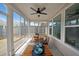 Cozy sunroom with comfortable seating and a ceiling fan at 518 Newstead Way, Woodstock, GA 30188