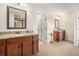 Primary bathroom with double vanities, granite countertops, and framed mirrors at 606 Discovery Ct, Acworth, GA 30102
