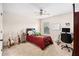 Bedroom with a ceiling fan, a bed with throw pillows, and a desk near the window at 606 Discovery Ct, Acworth, GA 30102