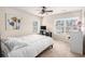 Bright bedroom with white bedding, windows and neutral walls at 606 Discovery Ct, Acworth, GA 30102